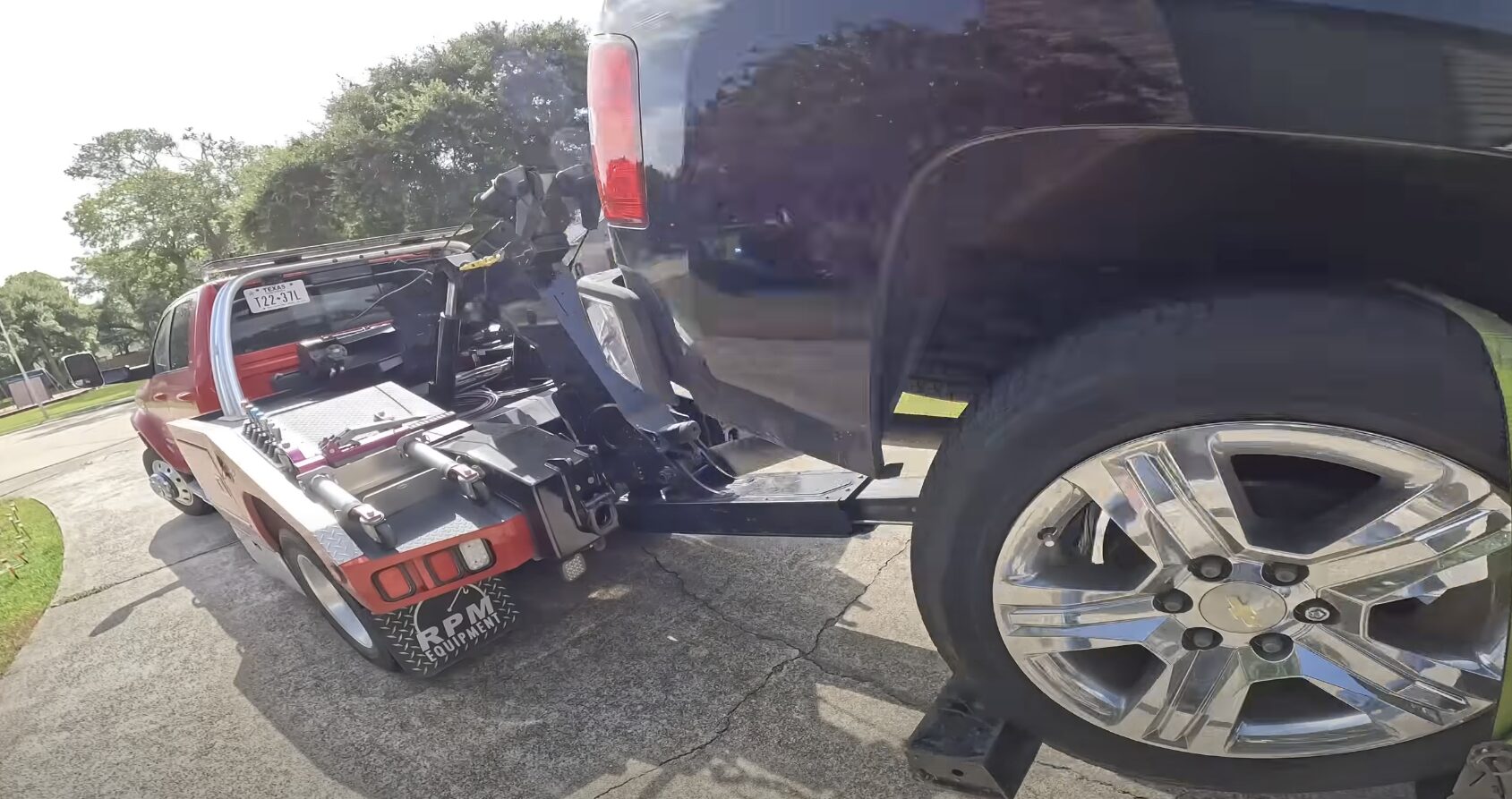 Professional towing service safely securing damaged vehicle after accident in Syracuse UT
