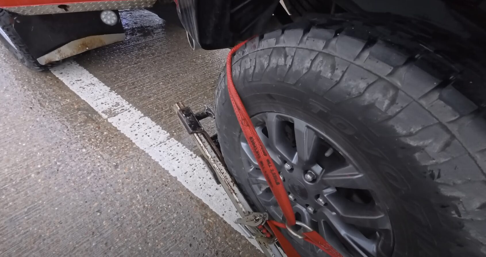 Accident Recovery Towing - KeenWorks Syracuse Towing Professional accident recovery towing service securing vehicle with safety straps in Syracuse UT